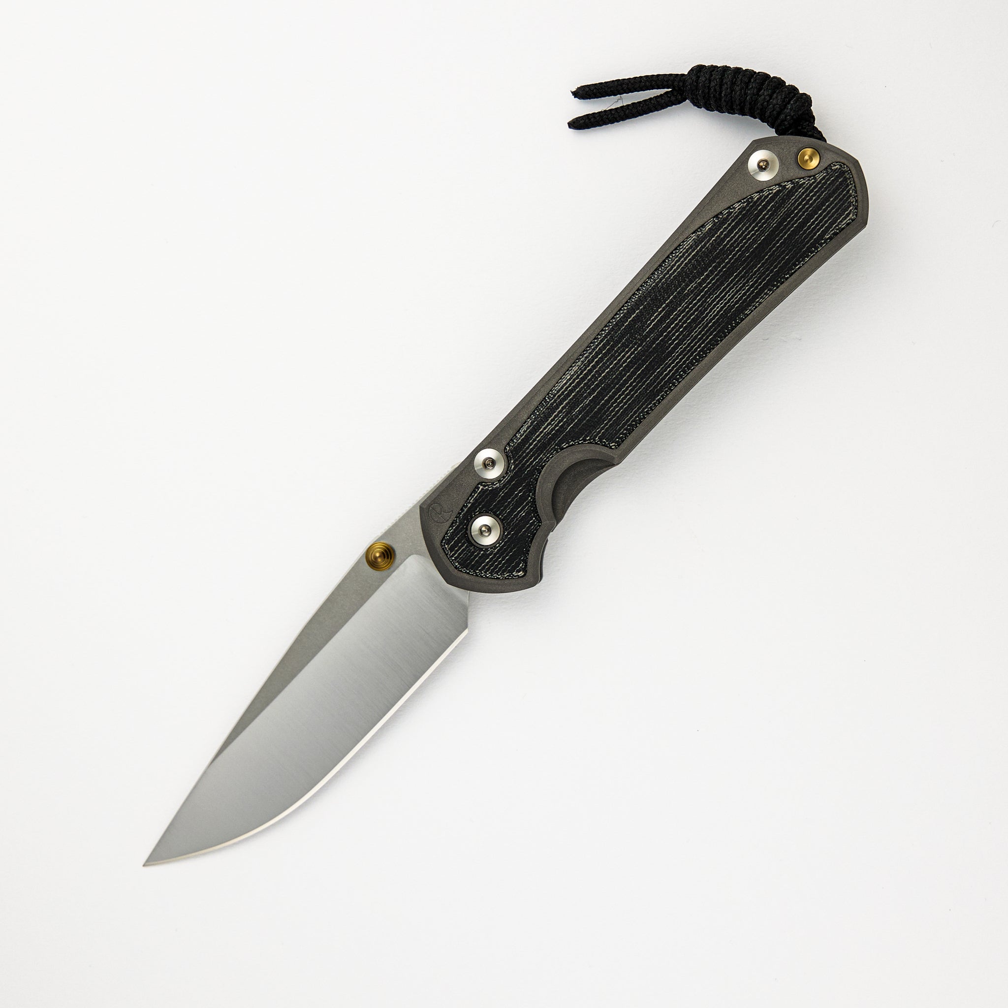 CHRIS REEVE LARGE SEBENZA 31 BLACK CANVAS MICARTA INLAY – POLISHED CPM MAGNACUT BLADE – GOLD DOUBLE THUMB LUGS