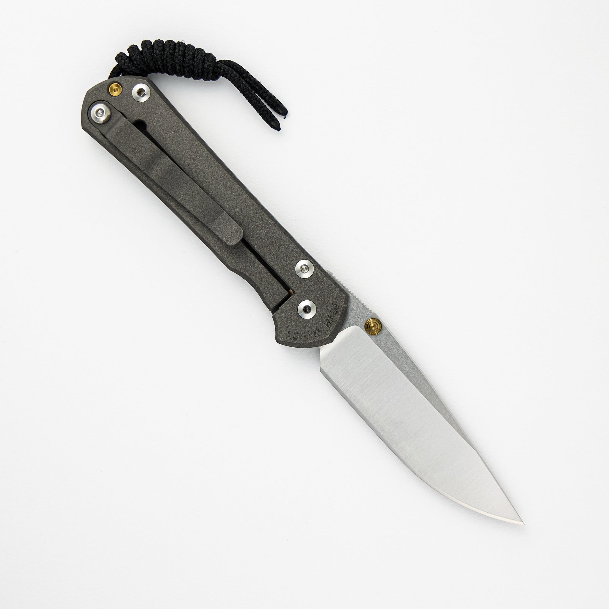 SMALL SEBENZA 31 – POLISHED CPM MAGNACUT BLADE – GOLD DOUBLE THUMB LUGS