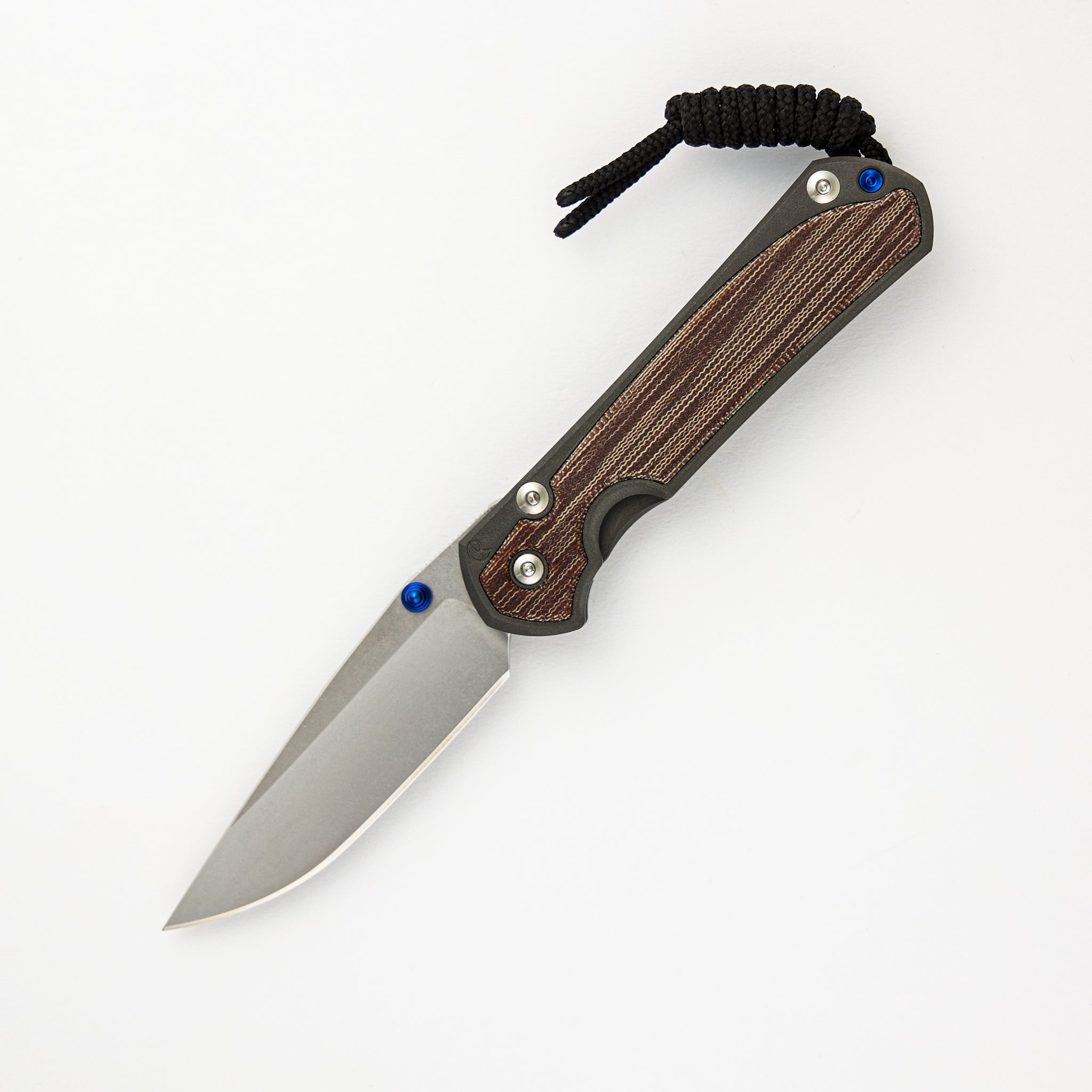 CHRIS REEVE SMALL SEBENZA 31 NATURAL CANVAS MICARTA INLAY – CPM MAGNACUT BLADE – BLUE DOUBLE THUMB LUGS