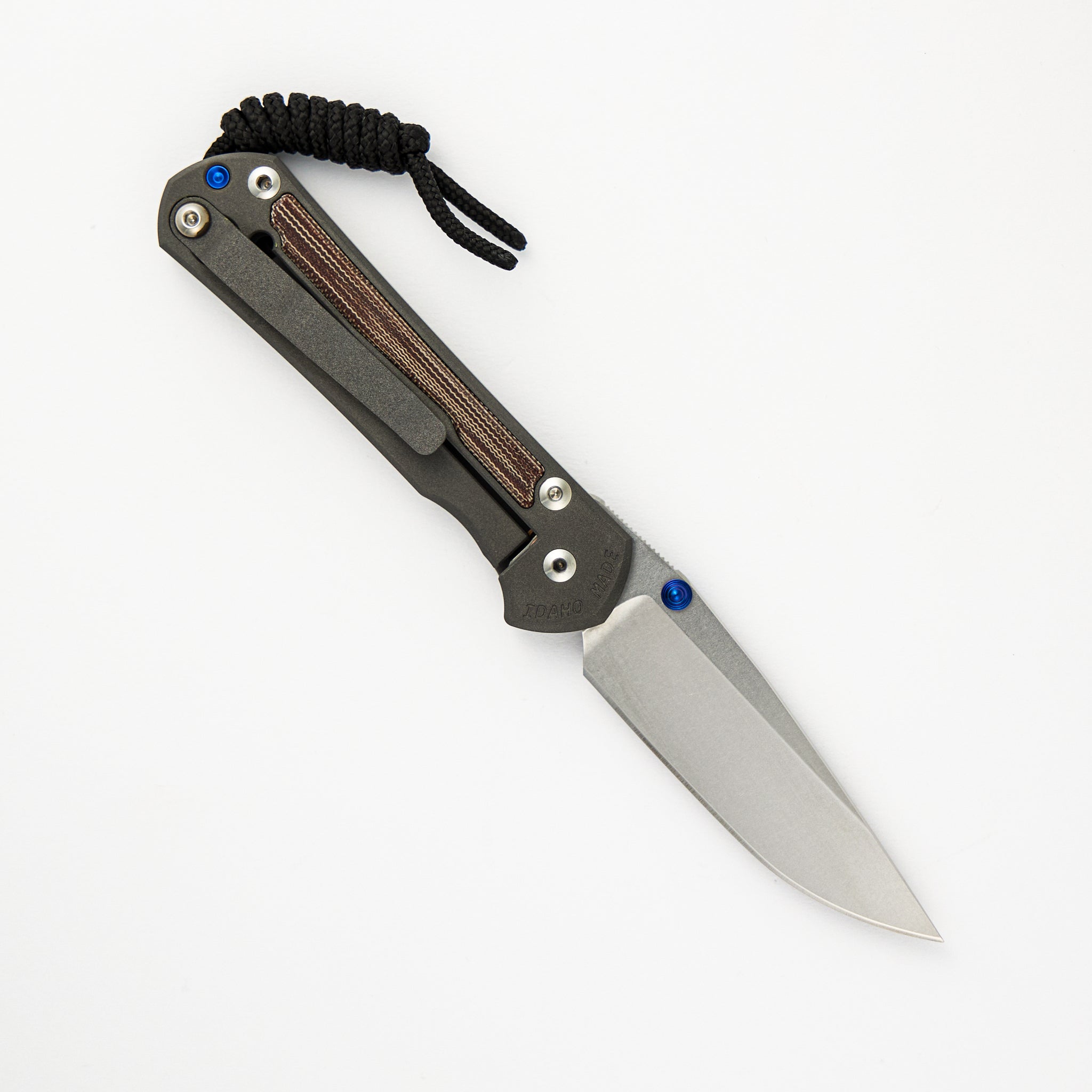 CHRIS REEVE SMALL SEBENZA 31 NATURAL CANVAS MICARTA INLAY – CPM MAGNACUT BLADE – BLUE DOUBLE THUMB LUGS