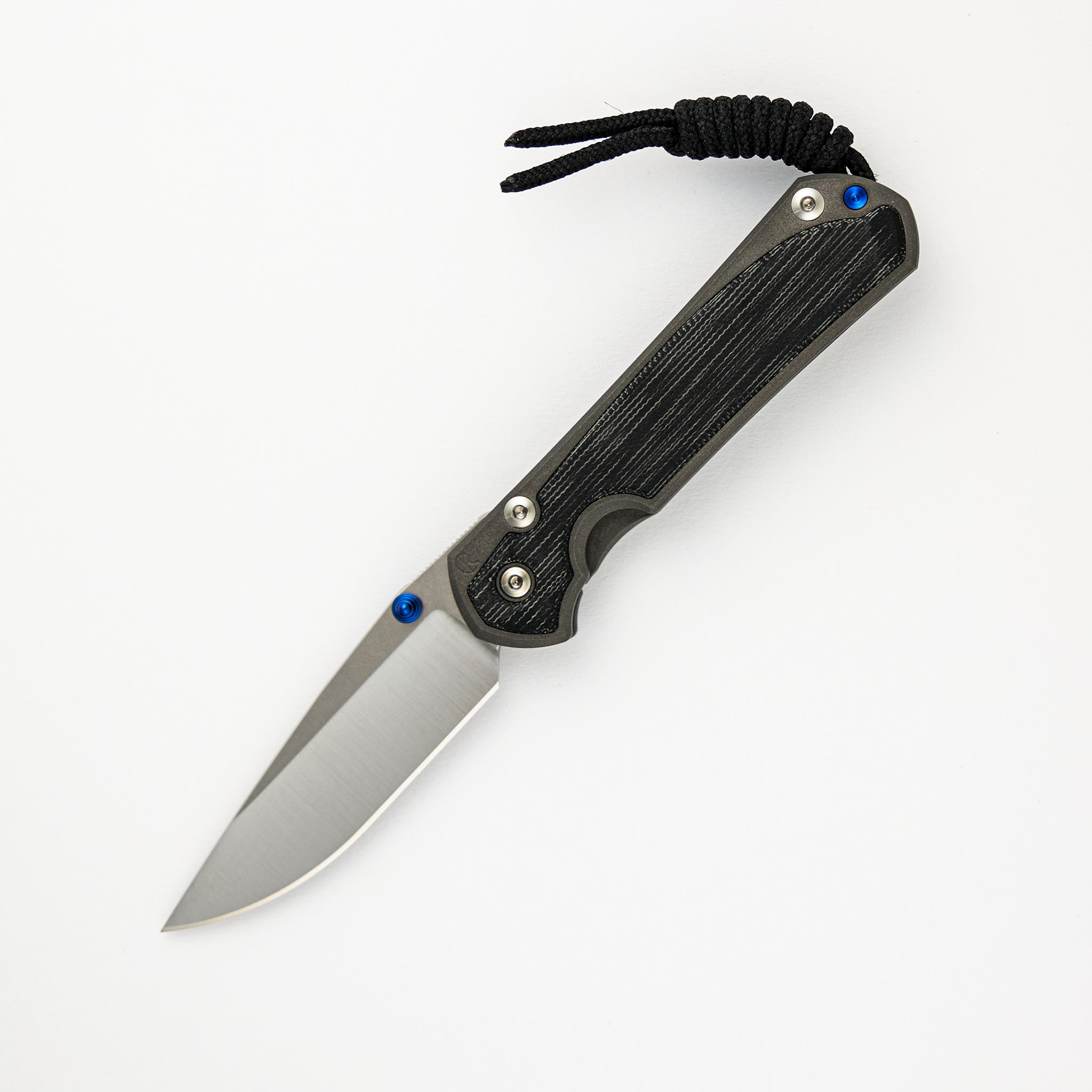 SMALL SEBENZA 31 BLACK CANVAS MICARTA INLAY – POLISHED CPM MAGNACUT BLADE – BLUE DOUBLE THUMB LUGS