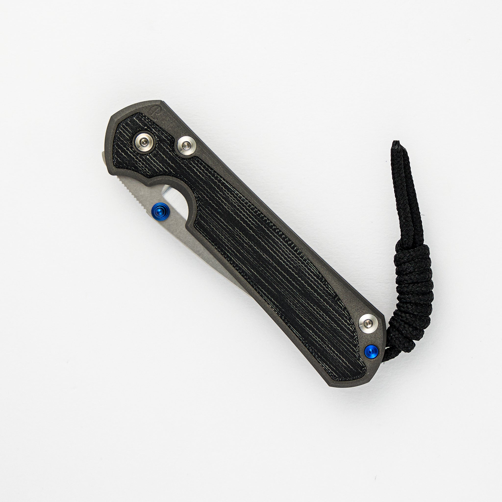SMALL SEBENZA 31 BLACK CANVAS MICARTA INLAY – POLISHED CPM MAGNACUT BLADE – BLUE DOUBLE THUMB LUGS