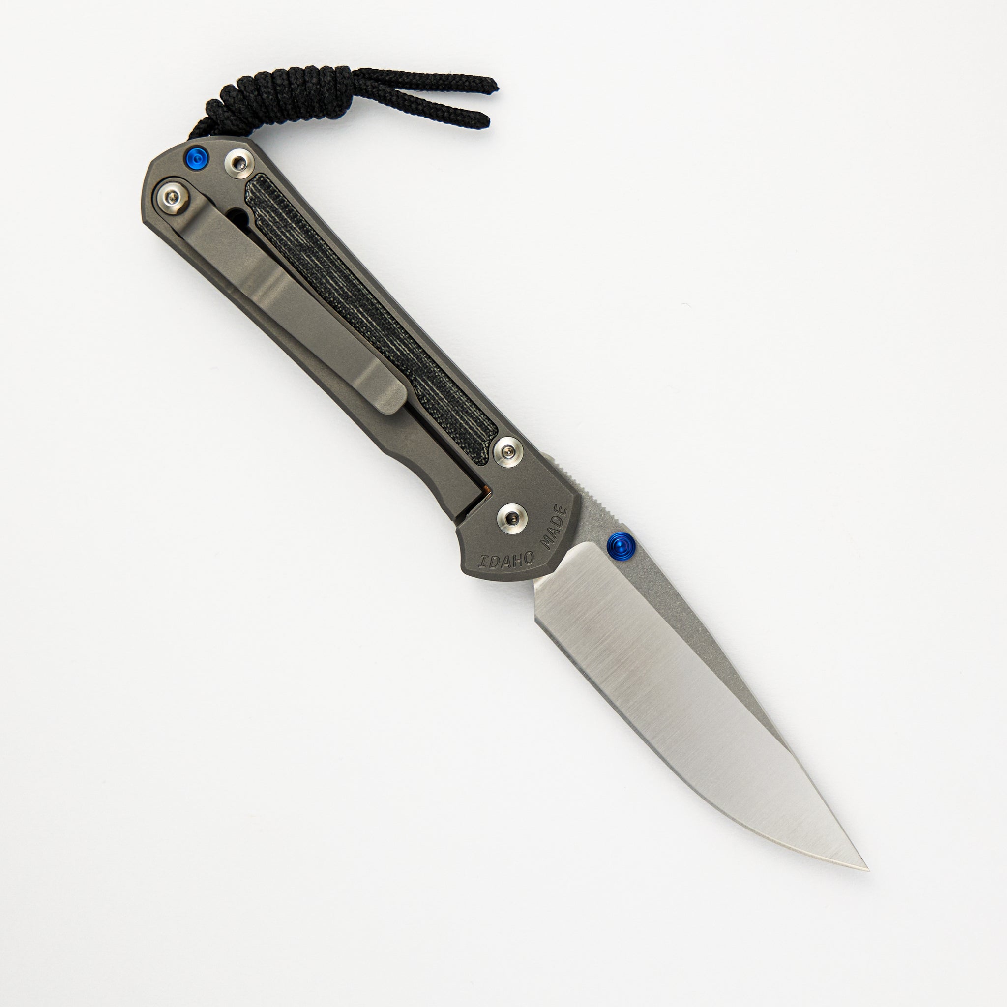 CHRIS REEVE SMALL SEBENZA 31 BLACK CANVAS MICARTA INLAY – POLISHED CPM MAGNACUT BLADE – GLASS BLASTED – BLUE DOUBLE THUMB LUGS