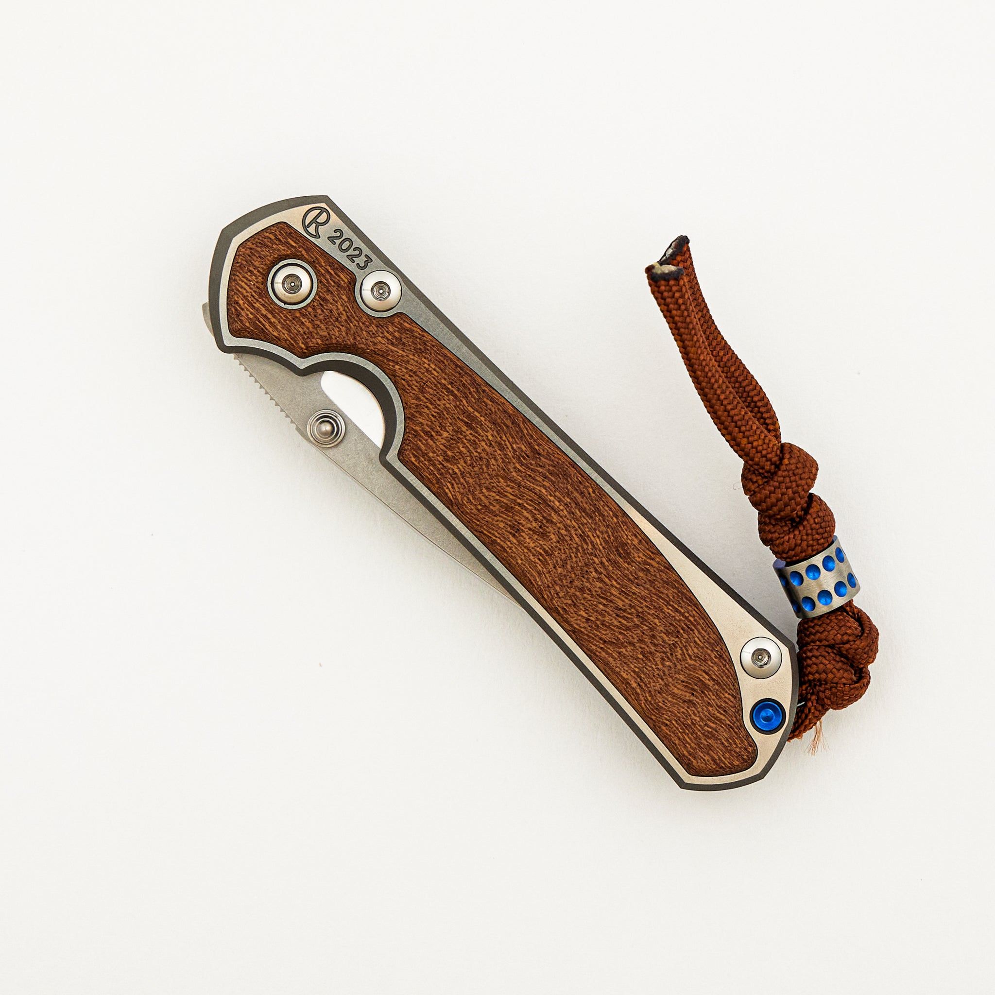 Small Sebenza 31 Annual 2023 - Sapele Mahogany Inlay - Polished Drop Point CPM MagnaCut Blade - Silver Single Thumb Lug