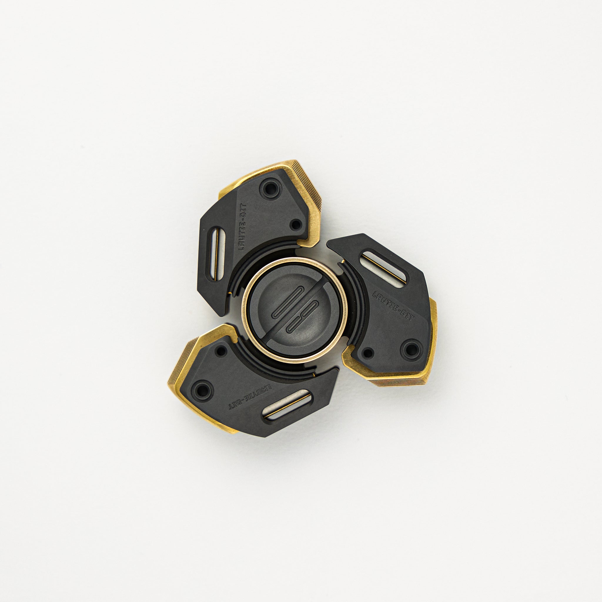 Bit 09 Fidget Spinner - 3 Fin - Brass/Zirconium