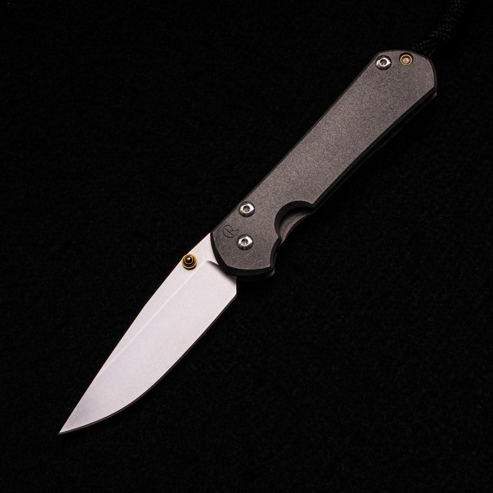 CHRIS REEVE SMALL SEBENZA 31 – GOLD DOUBLE THUMB LUGS – CPM S35VN BLADE