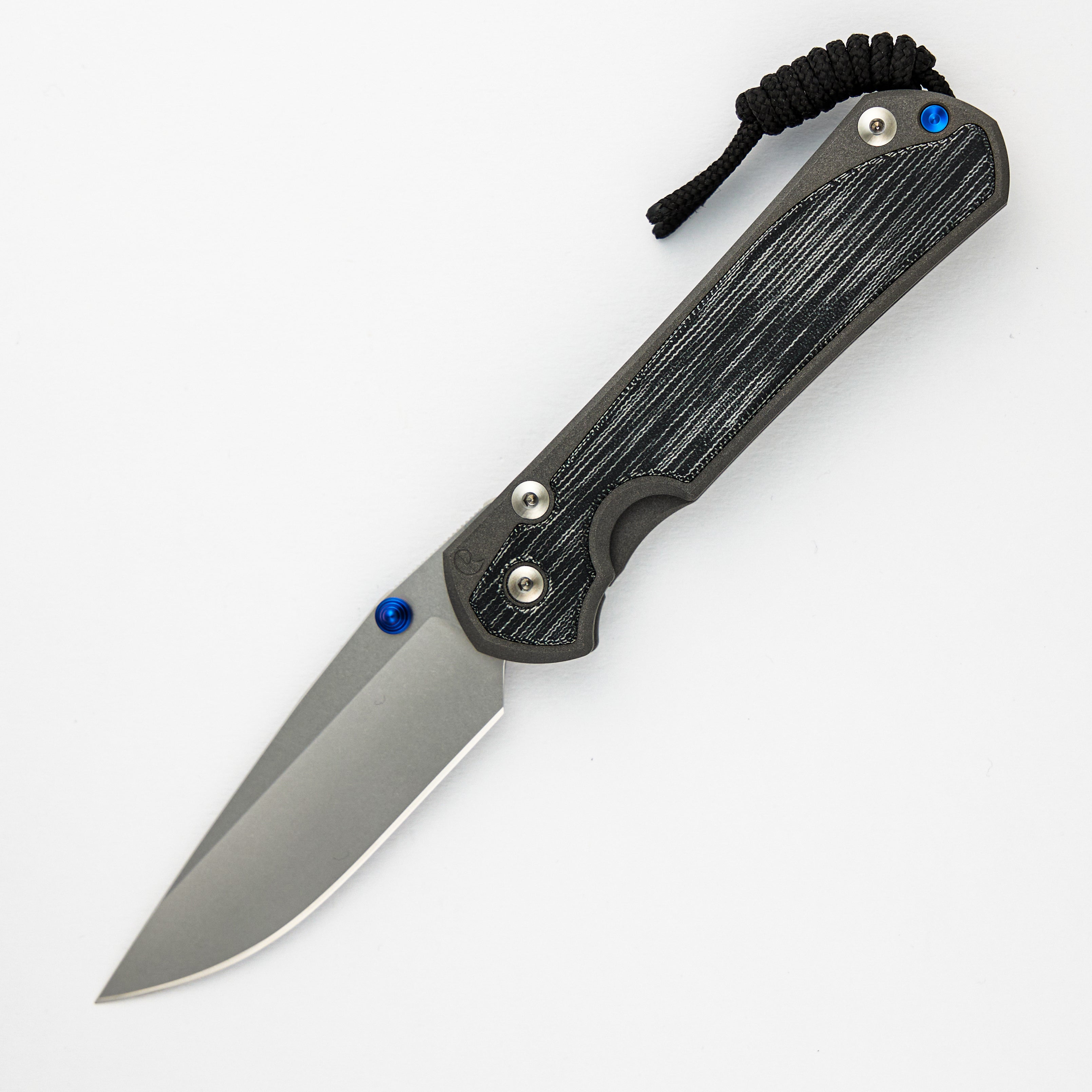 LARGE SEBENZA 31 BLACK CANVAS MICARTA INLAY – CPM MAGNACUT BLADE – BLUE DOUBLE THUMB LUGS