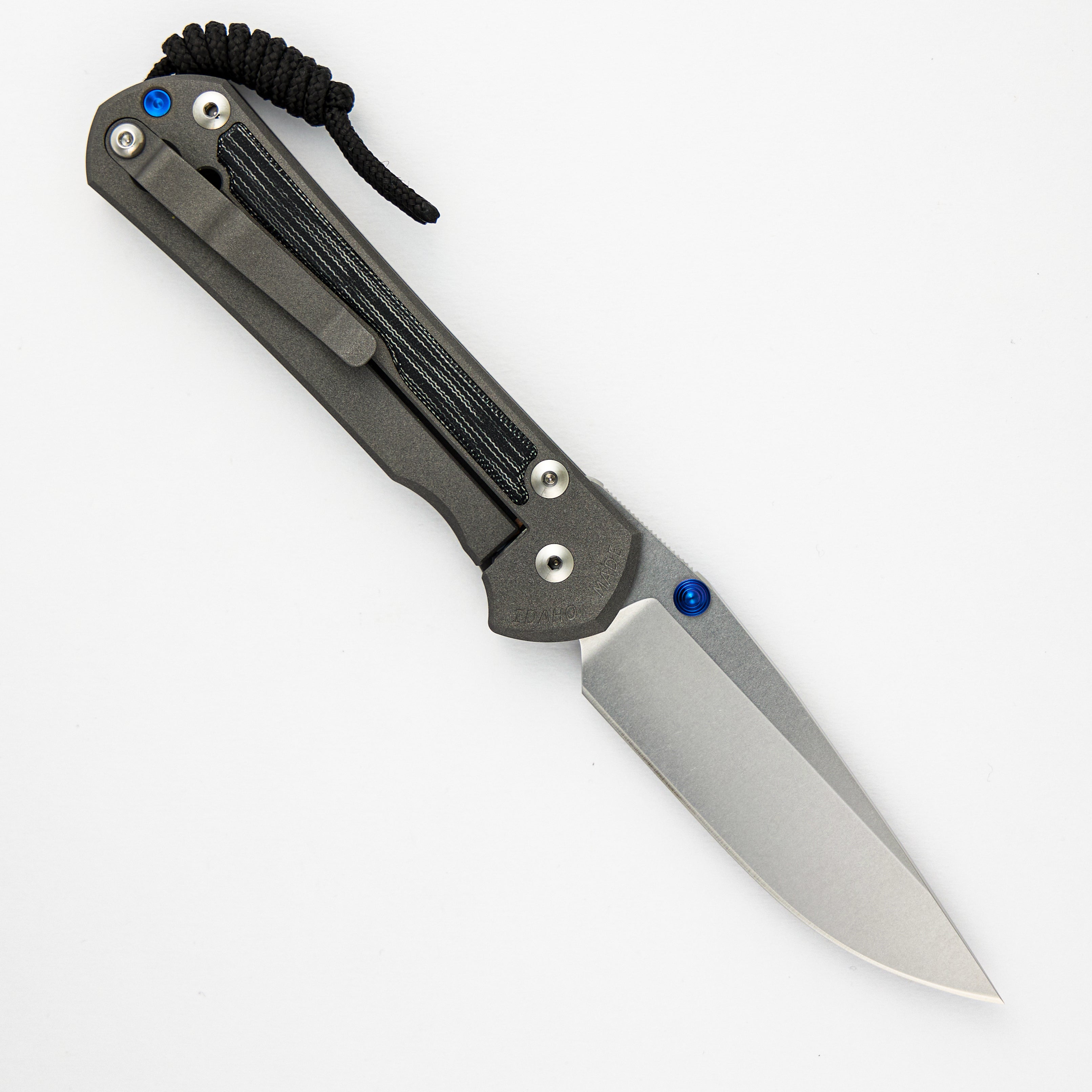 LARGE SEBENZA 31 BLACK CANVAS MICARTA INLAY – CPM MAGNACUT BLADE – BLUE DOUBLE THUMB LUGS