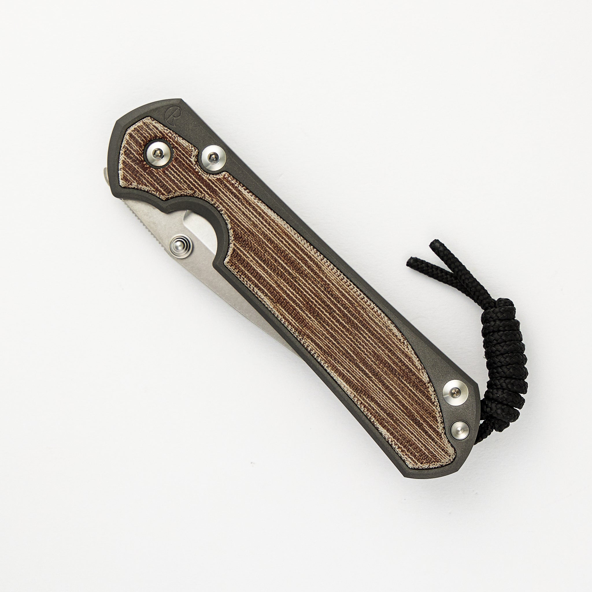 CHRIS REEVE LARGE SEBENZA 31 NATURAL CANVAS MICARTA INLAY – CPM MAGNACUT BLADE – SILVER DOUBLE THUMB LUGS