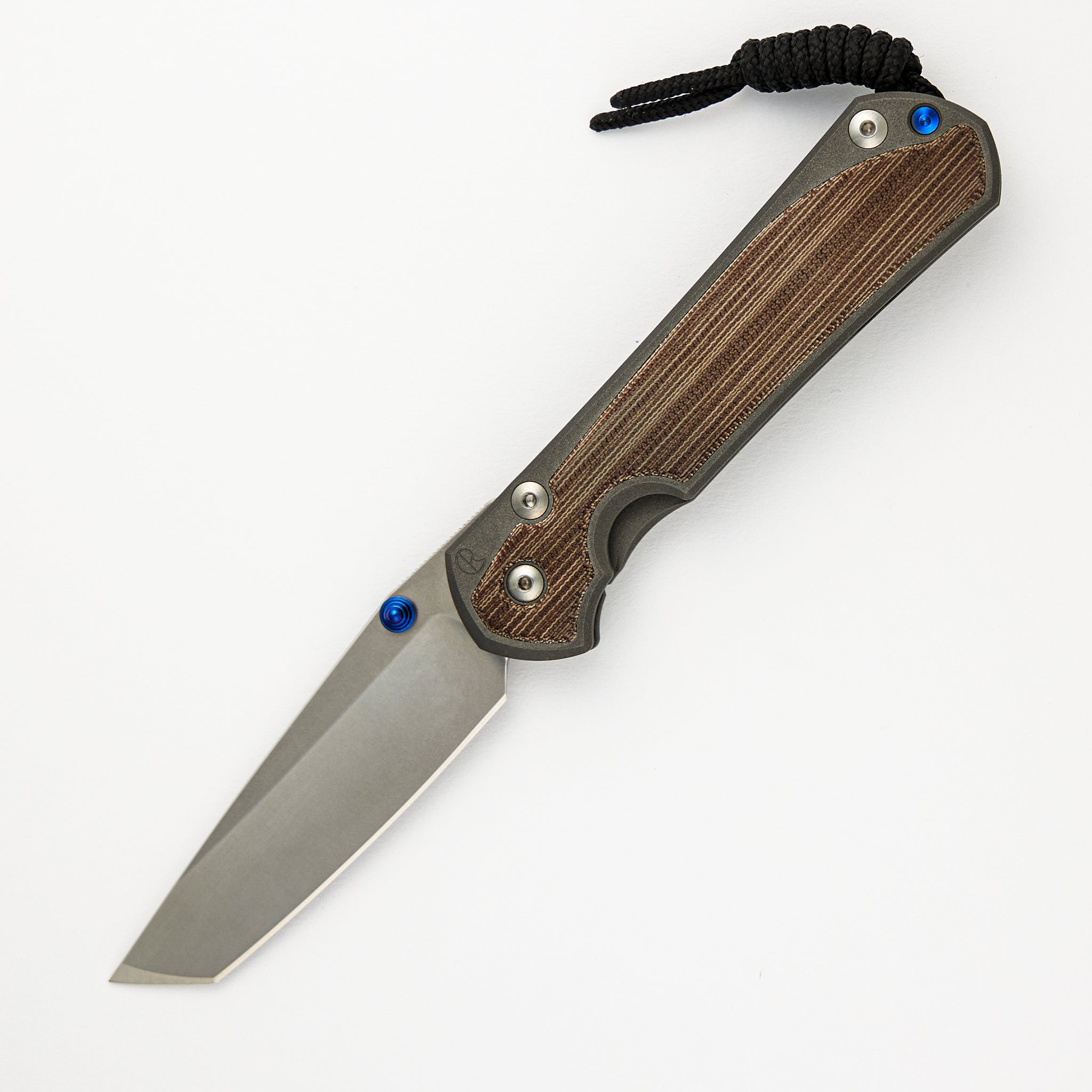 CHRIS REEVE LARGE SEBENZA 31 NATURAL CANVAS MICARTA INLAY – TANTO CPM MAGNACUT BLADE – BLUE DOUBLE THUMB LUGS