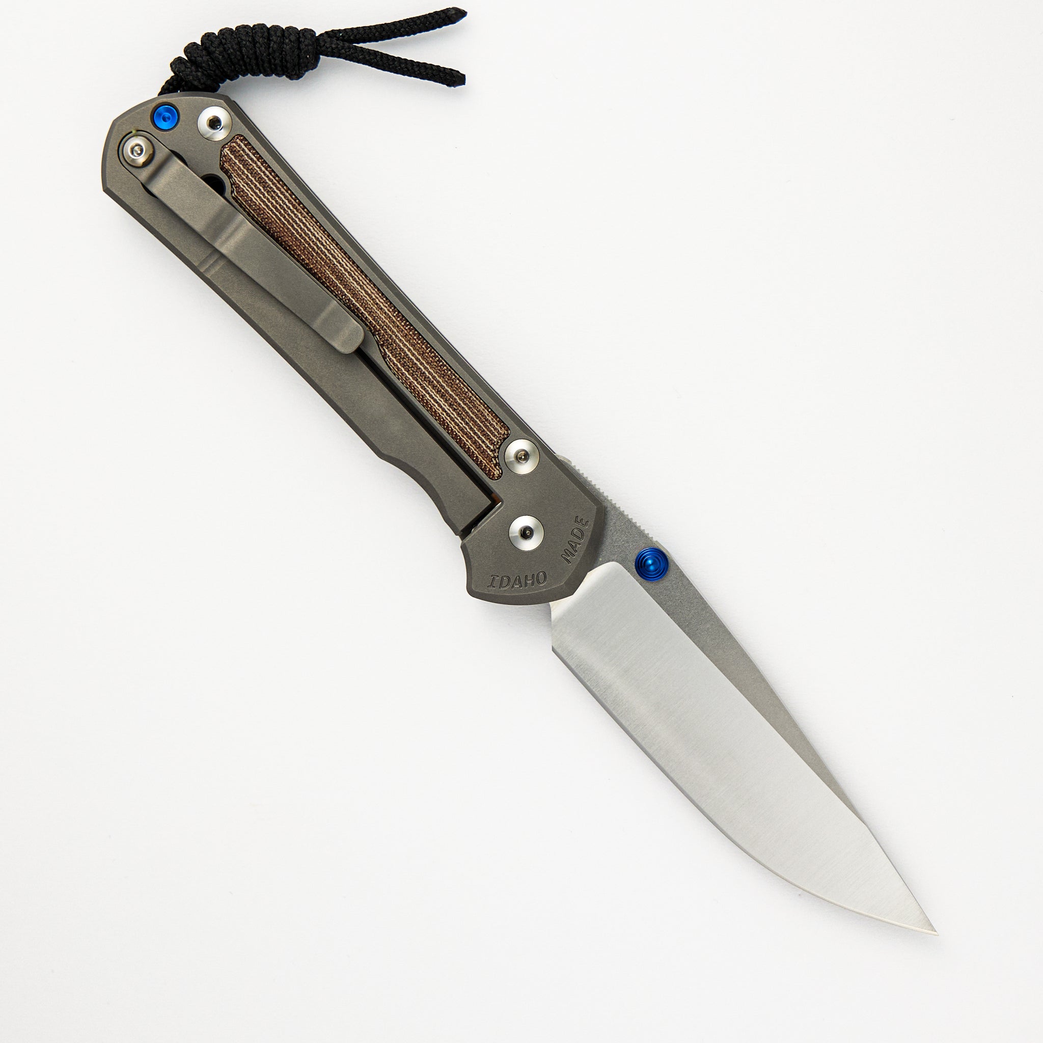 CHRIS REEVE LARGE SEBENZA 31 NATURAL CANVAS MICARTA INLAY – POLISHED CPM MAGNACUT BLADE – GLASS BLASTED – BLUE DOUBLE THUMB LUGS