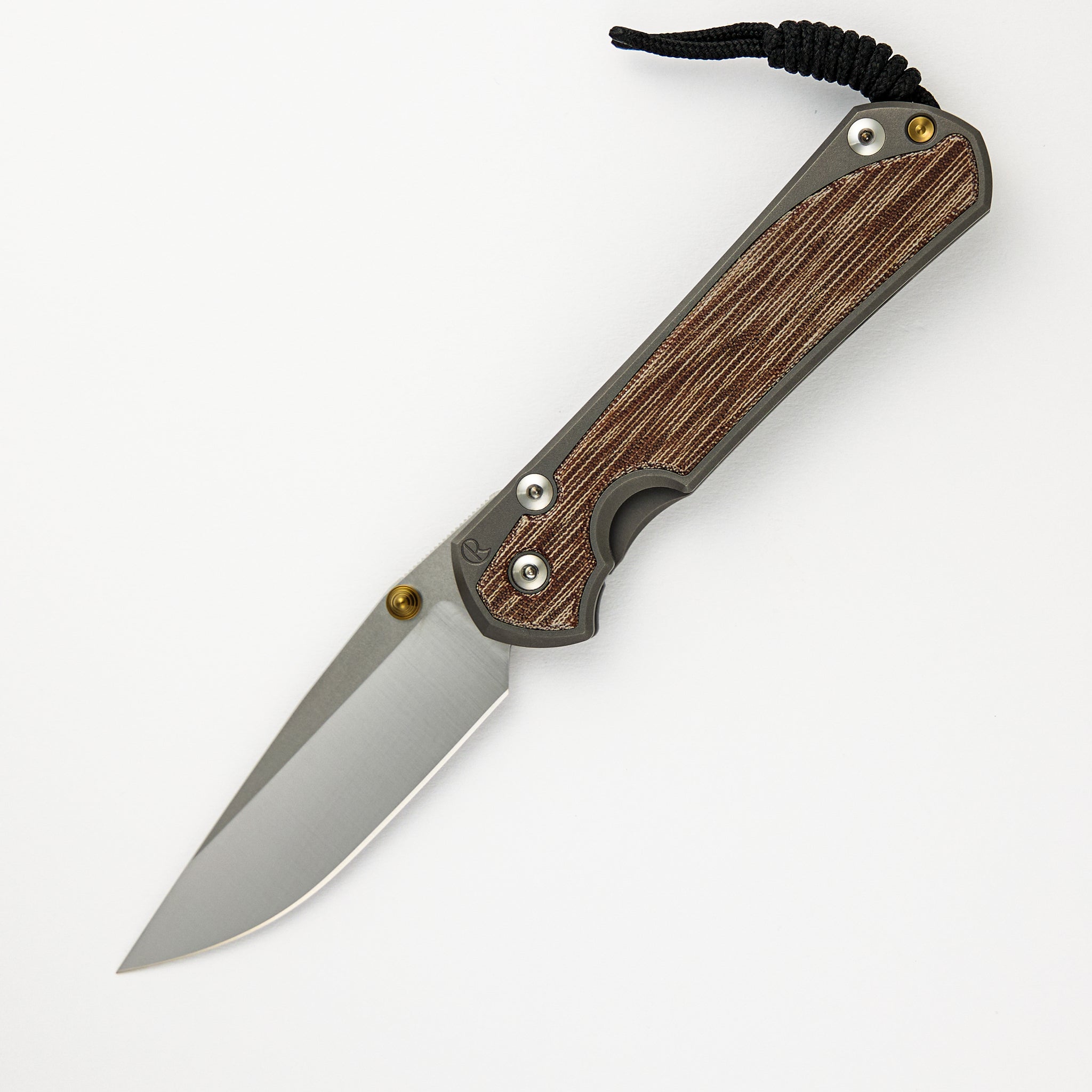 CHRIS REEVE LARGE SEBENZA 31 NATURAL CANVAS MICARTA INLAY – POLISHED CPM MAGNACUT BLADE – GLASS BLASTED – GOLD DOUBLE THUMB LUGS