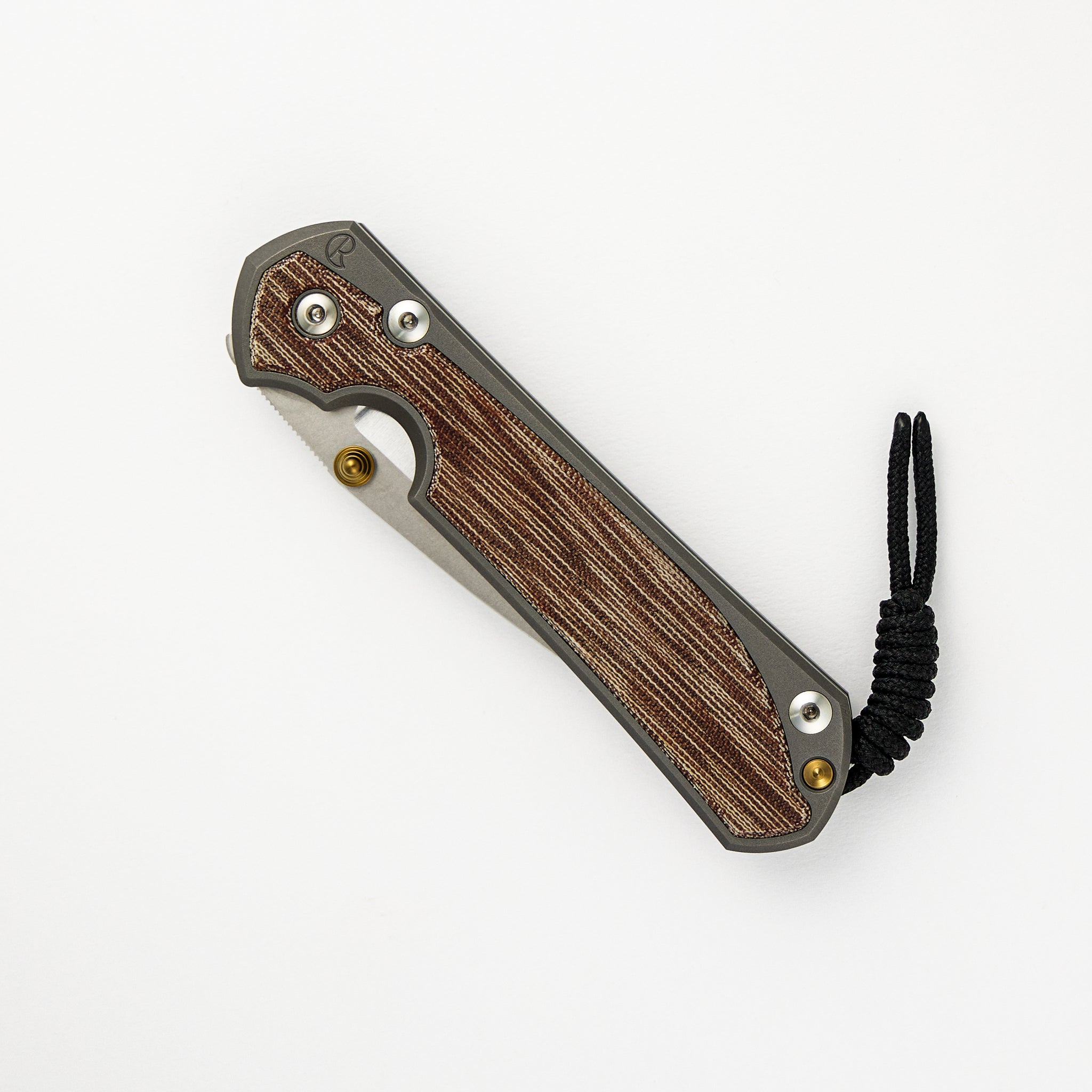 CHRIS REEVE LARGE SEBENZA 31 NATURAL CANVAS MICARTA INLAY – POLISHED CPM MAGNACUT BLADE – GLASS BLASTED – GOLD DOUBLE THUMB LUGS