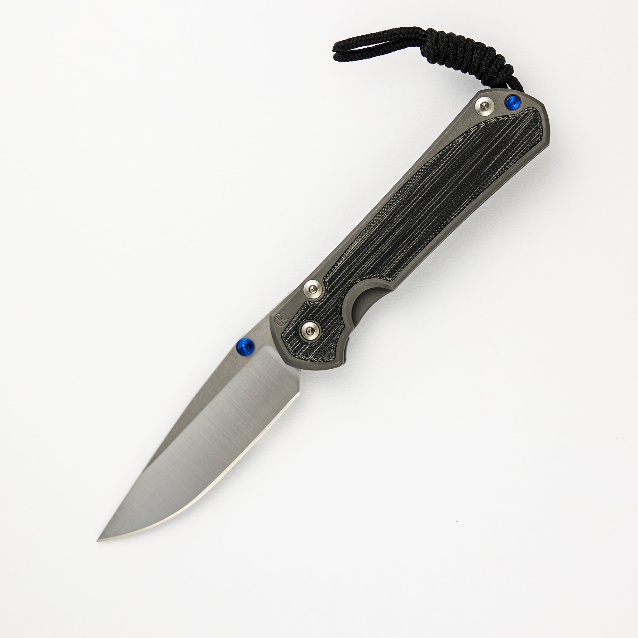 CHRIS REEVE SMALL SEBENZA 31 BLACK CANVAS MICARTA INLAY – POLISHED CPM MAGNACUT BLADE – GLASS BLASTED – BLUE DOUBLE THUMB LUGS