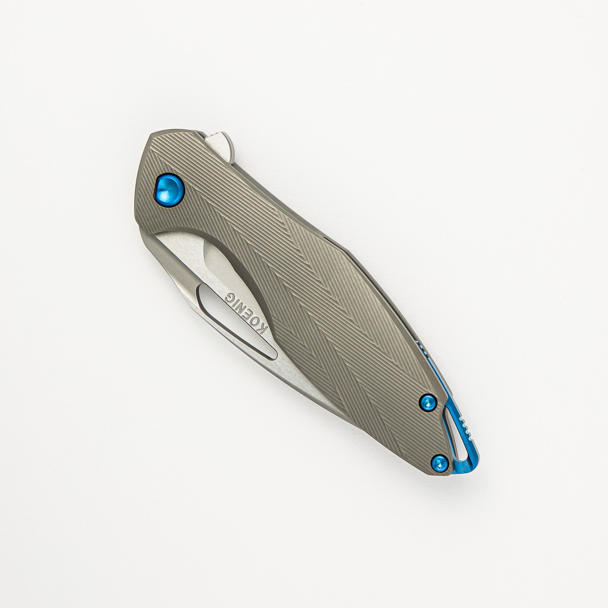 Mini Arius - Patterned Titanium Handle - Blue Hardware -  Burnished W/ Polished Flats M390 Blade