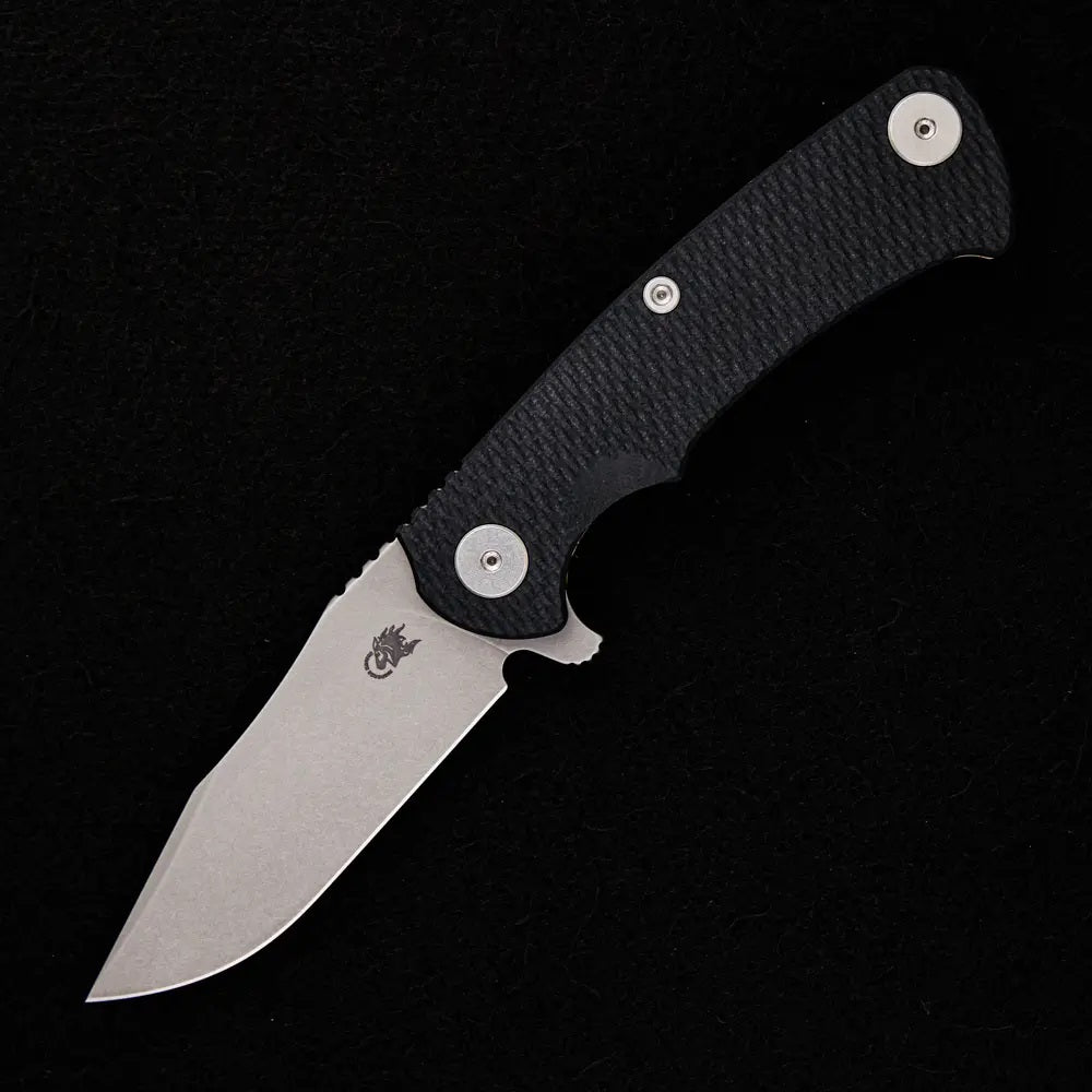 HINDERER PROJECT X – STONEWASH MAGNACUT CLIP POINT – TRI-WAY – BATTLE BRONZE – BLACK G10