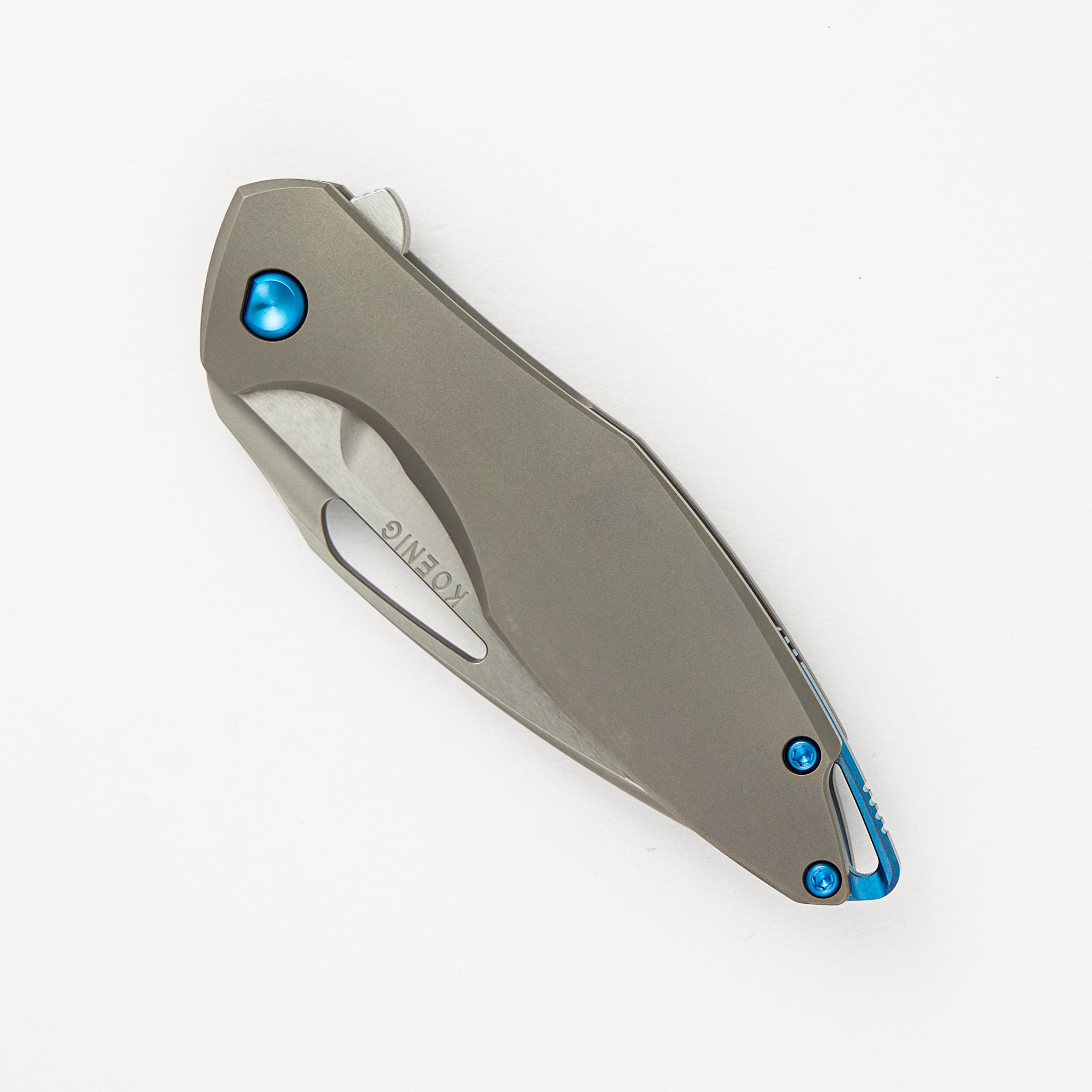 Koenig Mini Arius - Smooth Titanium Handle - Blue Hardware -  Burnished W/ Polished Flats M390 Blade