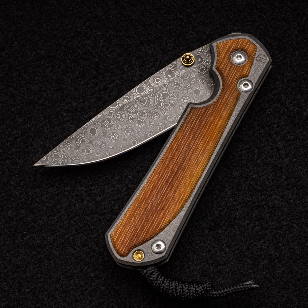 CHRIS REEVE LARGE SEBENZA 31 NATURAL CANVAS MICARTA INLAY - RAINDROP BLADE - GOLD DOUBLE THUMB LUGS