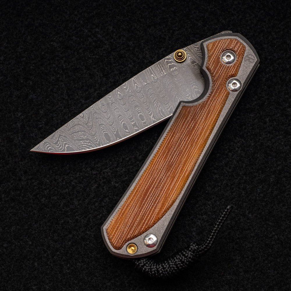 CHRIS REEVE LARGE SEBENZA 31 NATURAL CANVAS MICARTA INLAY - LADDER BLADE - GOLD DOUBLE THUMB LUGS