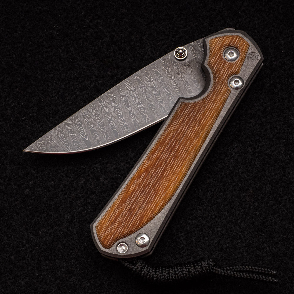 CHRIS REEVE LARGE SEBENZA 31 NATURAL CANVAS MICARTA INLAY - LADDER BLADE - SILVER DOUBLE THUMB LUGS