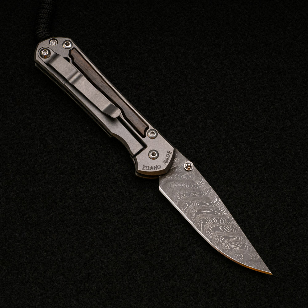 CHRIS REEVE SMALL SEBENZA 31 MACASSAR INLAY - BOOMERANG BLADE - SILVER DOUBLE THUMB LUGS