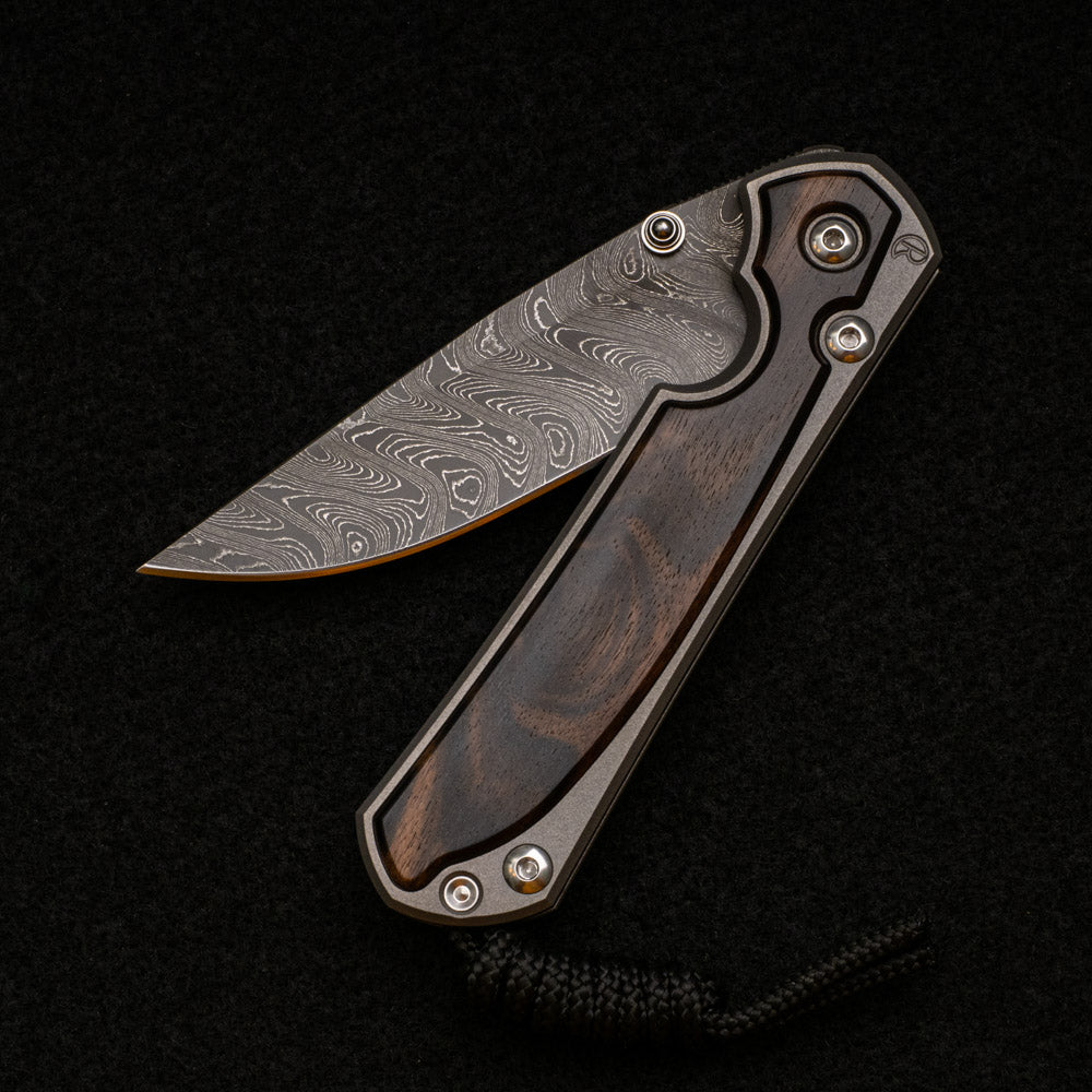 CHRIS REEVE SMALL SEBENZA 31 MACASSAR INLAY - BOOMERANG BLADE - SILVER DOUBLE THUMB LUGS