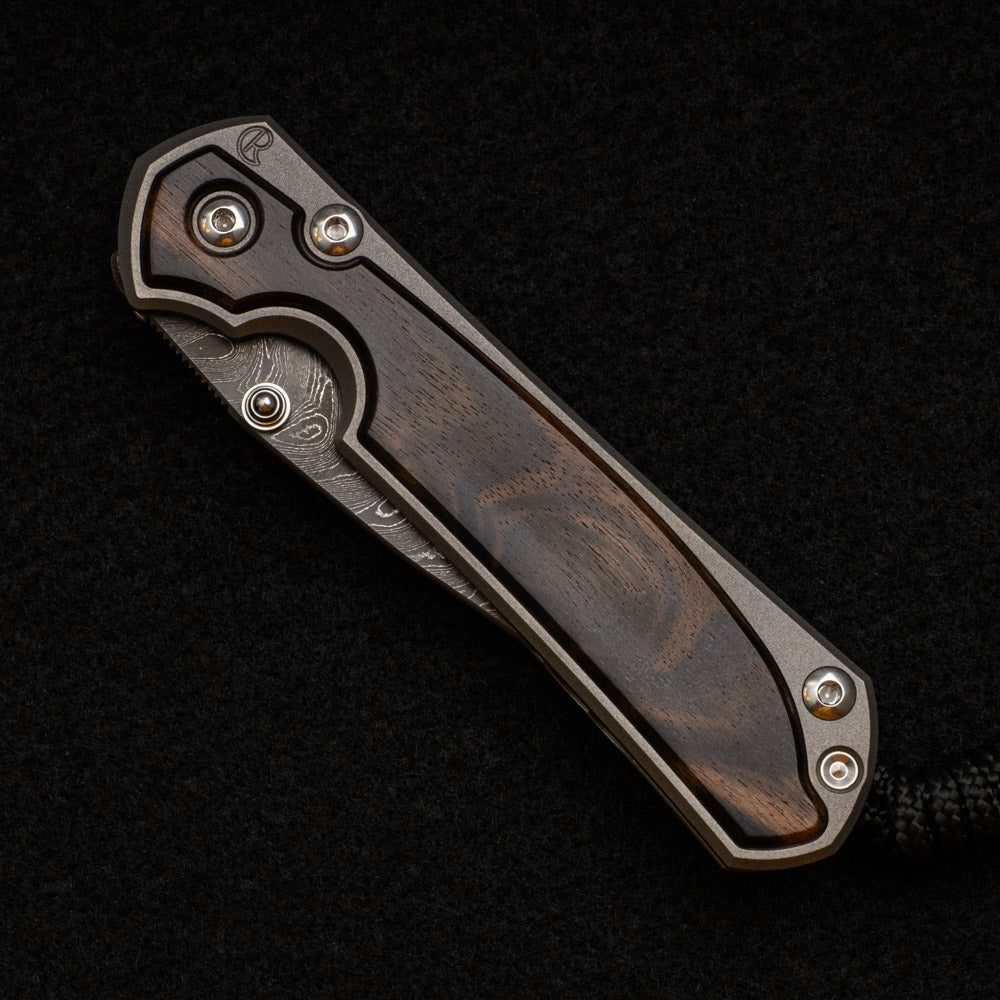 CHRIS REEVE SMALL SEBENZA 31 MACASSAR INLAY - BOOMERANG BLADE - SILVER DOUBLE THUMB LUGS