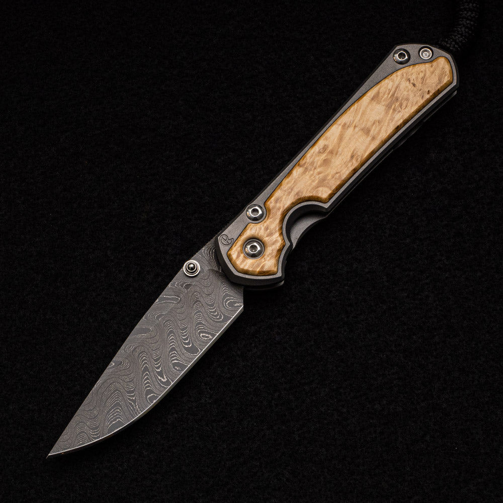 CHRIS REEVE SMALL SEBENZA 31 BOX ELDER BURL INLAY - BOOMERANG BLADE - SILVER DOUBLE THUMB LUGS