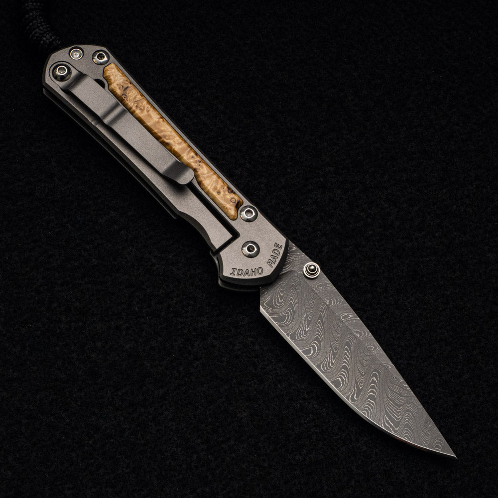 CHRIS REEVE SMALL SEBENZA 31 BOX ELDER BURL INLAY - BOOMERANG BLADE - SILVER DOUBLE THUMB LUGS