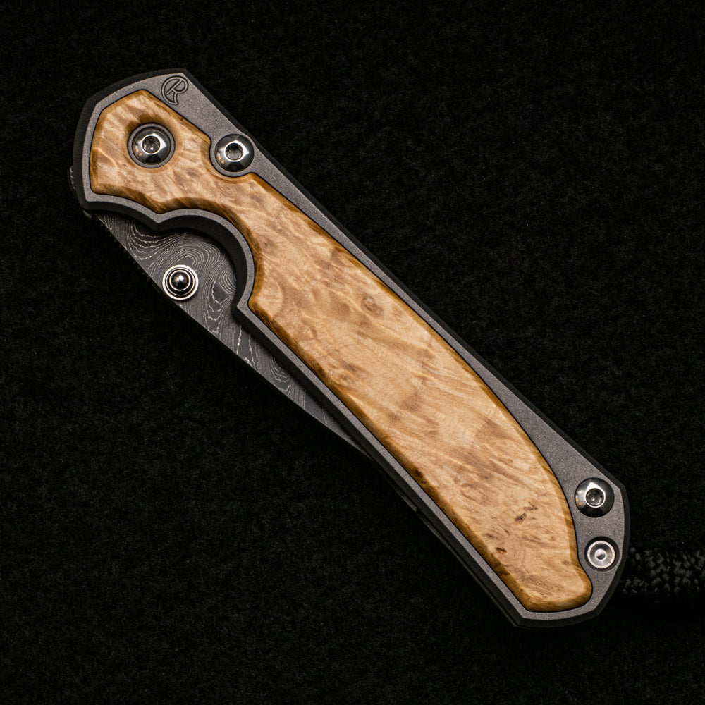 CHRIS REEVE SMALL SEBENZA 31 BOX ELDER BURL INLAY - BOOMERANG BLADE - SILVER DOUBLE THUMB LUGS