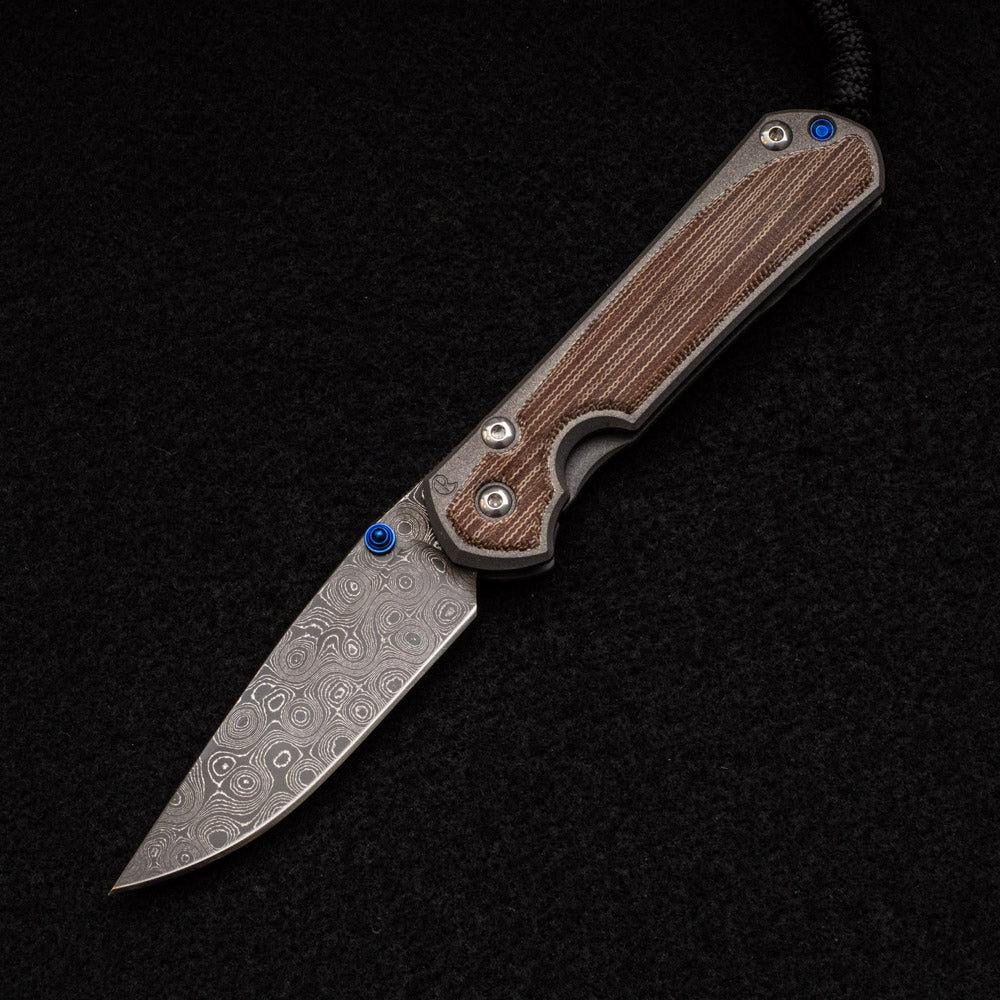 CHRIS REEVE SMALL SEBENZA 31 NATURAL CANVAS MICARTA INLAY - RAINDROP BLADE - BLUE DOUBLE THUMB LUGS