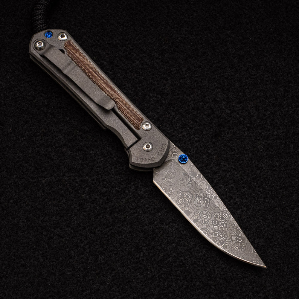 CHRIS REEVE SMALL SEBENZA 31 NATURAL CANVAS MICARTA INLAY - RAINDROP BLADE - BLUE DOUBLE THUMB LUGS