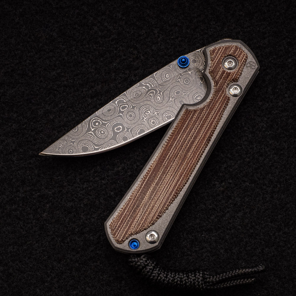 CHRIS REEVE SMALL SEBENZA 31 NATURAL CANVAS MICARTA INLAY - RAINDROP BLADE - BLUE DOUBLE THUMB LUGS