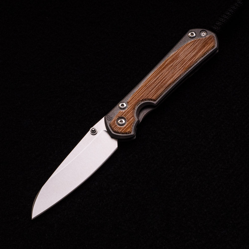 CHRIS REEVE SMALL SEBENZA 31 NATURAL CANVAS MICARTA INLAY – CPM MAGNACUT INSINGO BLADE – SILVER DOUBLE THUMB LUGS