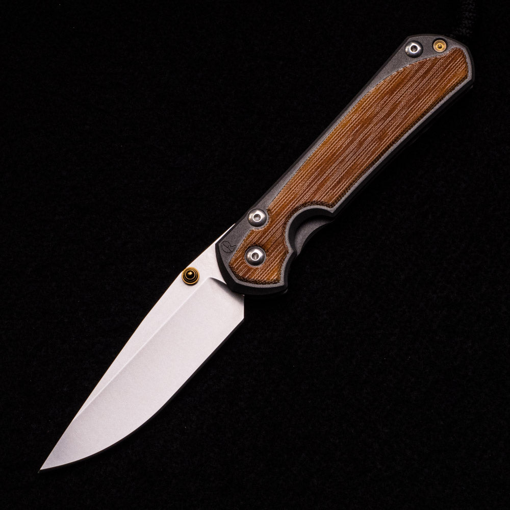 CHRIS REEVE LARGE SEBENZA 31 NATURAL CANVAS MICARTA INLAY – CPM MAGNACUT BLADE – GOLD DOUBLE THUMB LUGS