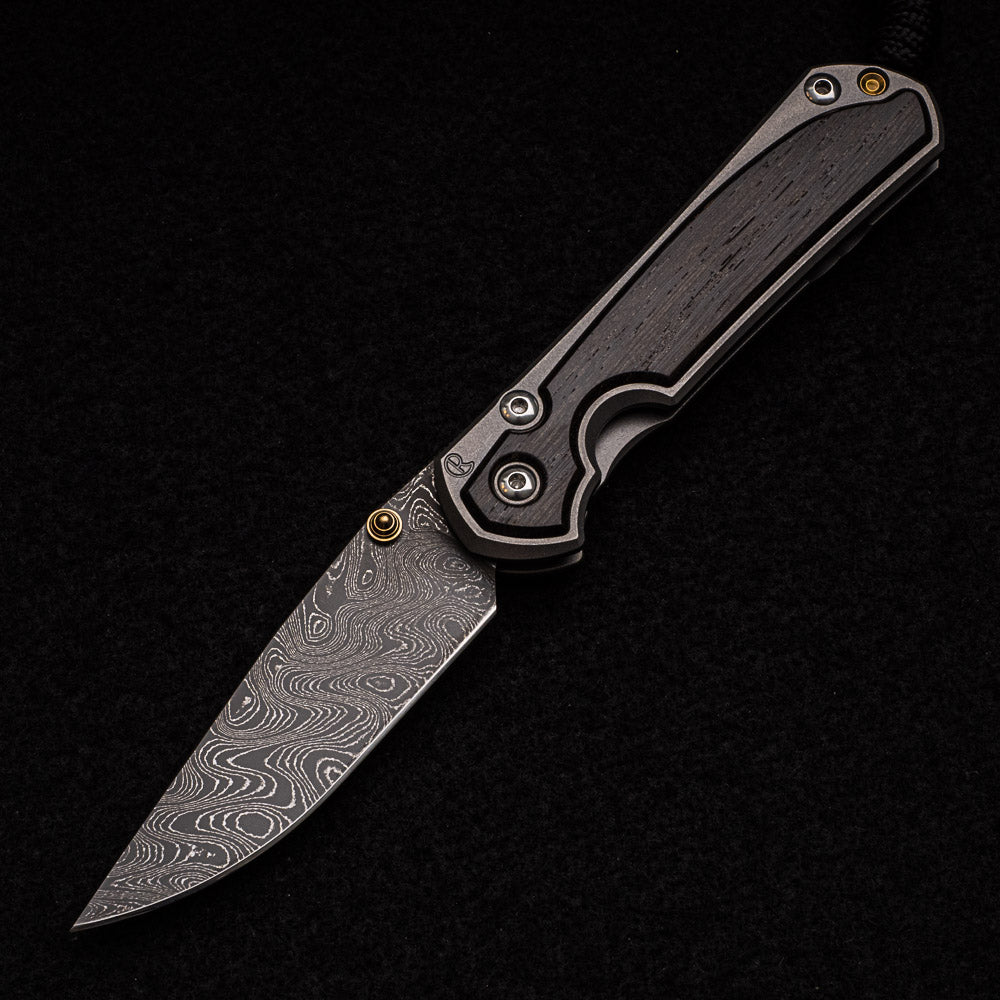 CHRIS REEVE SMALL SEBENZA 31 BOG OAK INLAY - BOOMERANG BLADE - GOLD DOUBLE THUMB LUGS