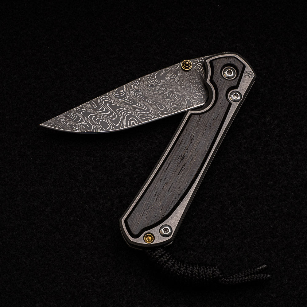 CHRIS REEVE SMALL SEBENZA 31 BOG OAK INLAY - BOOMERANG BLADE - GOLD DOUBLE THUMB LUGS