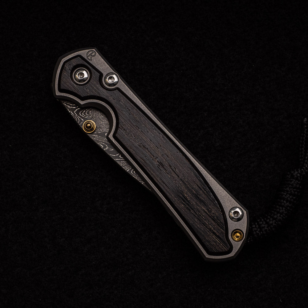 CHRIS REEVE SMALL SEBENZA 31 BOG OAK INLAY - BOOMERANG BLADE - GOLD DOUBLE THUMB LUGS