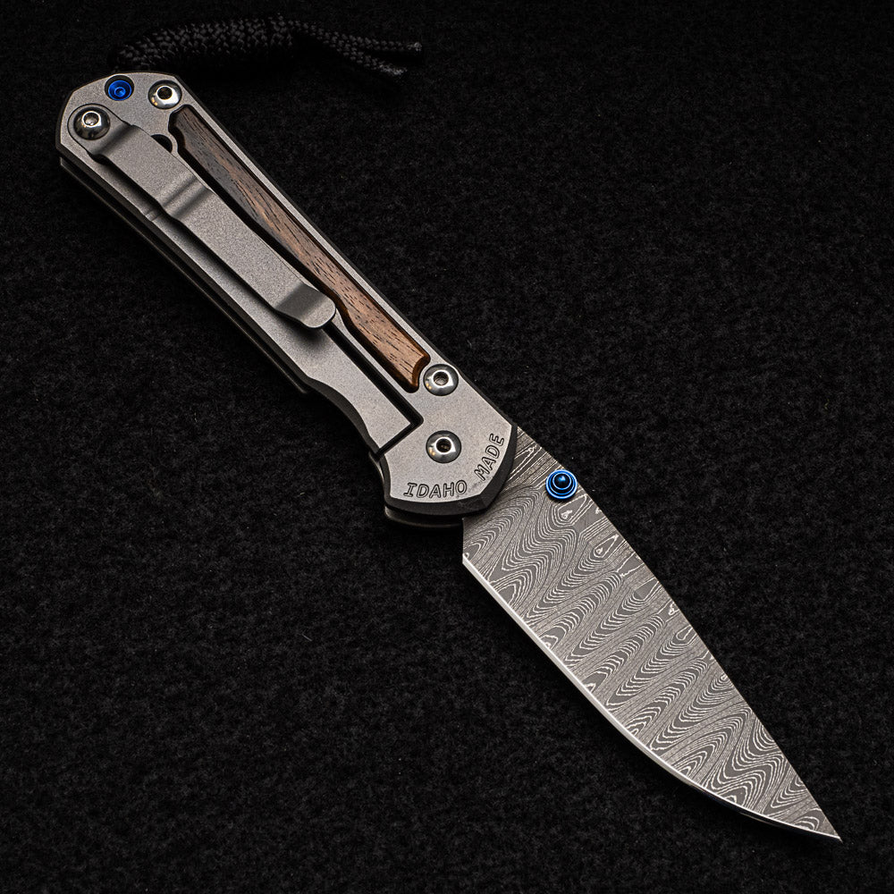 CHRIS REEVE SMALL SEBENZA 31 MACASSAR EBONY - LADDER BLADE - BLUE DOUBLE THUMB LUGS