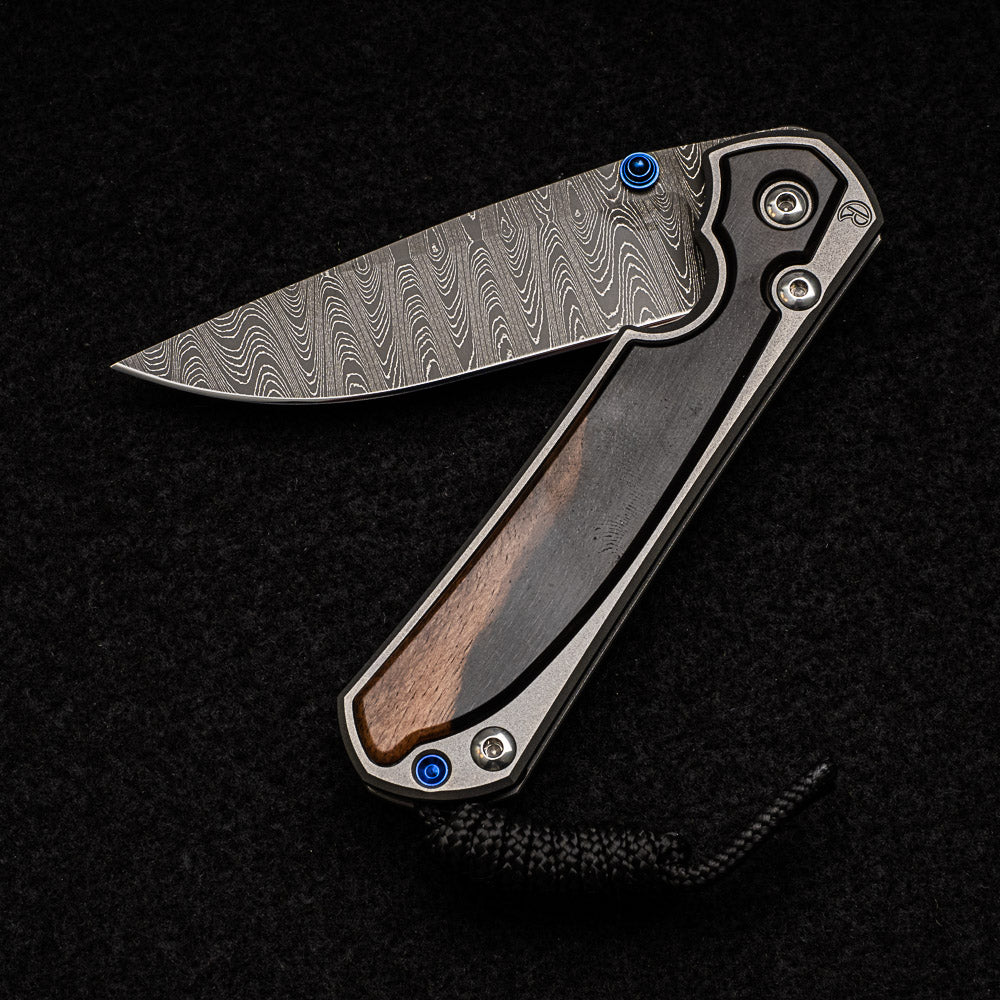 CHRIS REEVE SMALL SEBENZA 31 MACASSAR EBONY - LADDER BLADE - BLUE DOUBLE THUMB LUGS