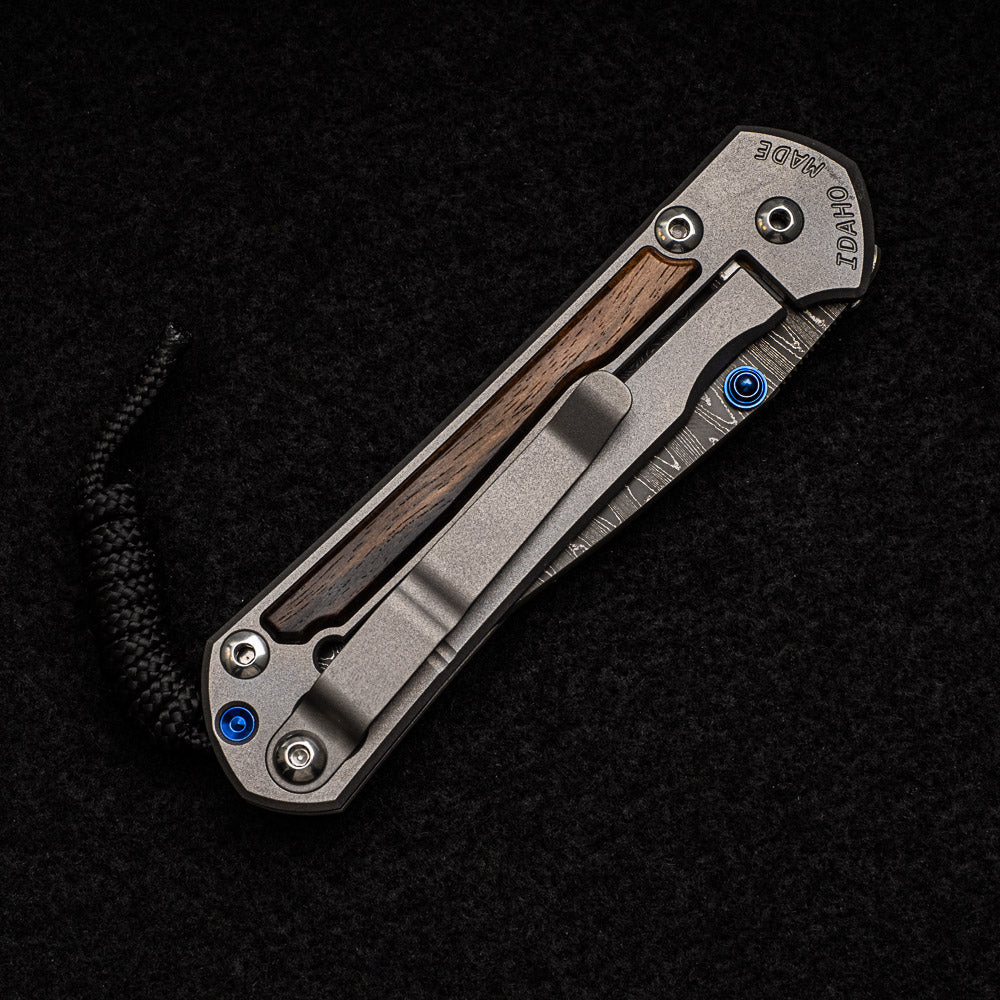 CHRIS REEVE SMALL SEBENZA 31 MACASSAR EBONY - LADDER BLADE - BLUE DOUBLE THUMB LUGS