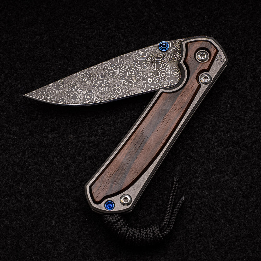 CHRIS REEVE SMALL SEBENZA 31 MACASSAR EBONY - RAINDROP BLADE - BLUE DOUBLE THUMB LUGS