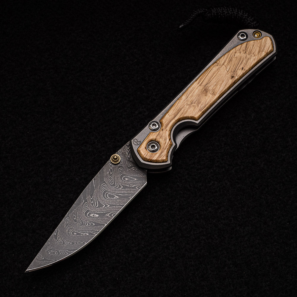 CHRIS REEVE SMALL SEBENZA 31 BOX ELDER INLAY - BOOMERANG BLADE - GOLD DOUBLE THUMB LUGS