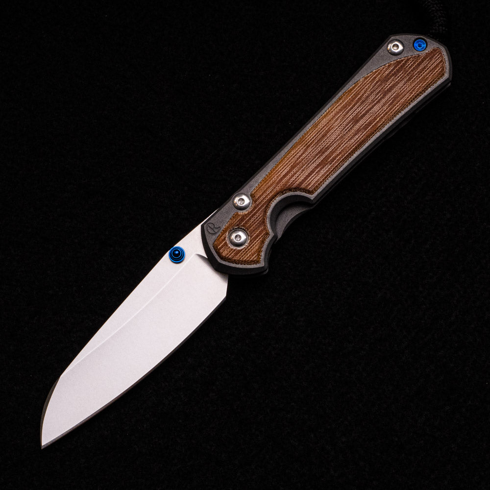 CHRIS REEVE LARGE SEBENZA 31 NATURAL CANVAS MICARTA INLAY – INSINGO CPM MAGNACUT BLADE – BLUE DOUBLE THUMB LUGS