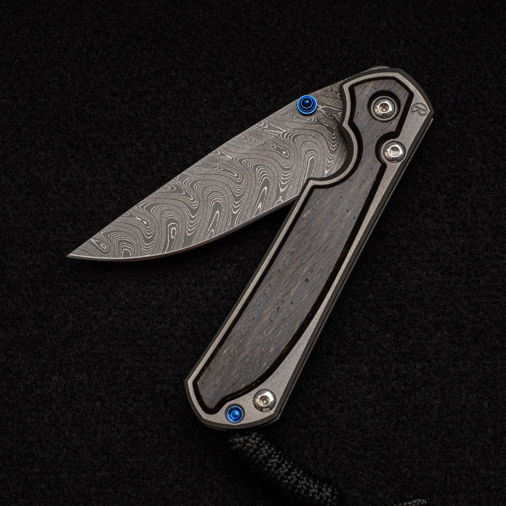 CHRIS REEVE SMALL SEBENZA 31 BOG OAK INLAY - BOOMERANG BLADE - BLUE DOUBLE THUMB LUGS