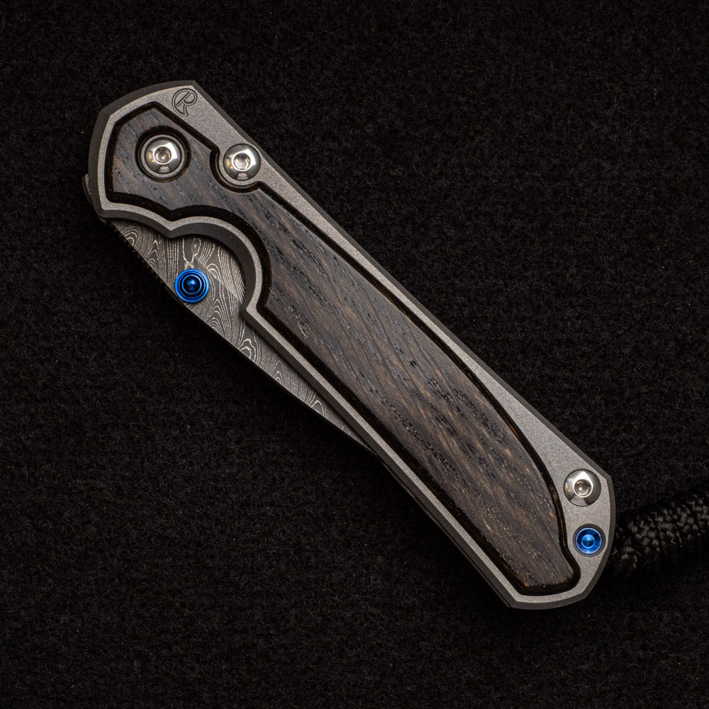 CHRIS REEVE SMALL SEBENZA 31 BOG OAK INLAY - BOOMERANG BLADE - BLUE DOUBLE THUMB LUGS