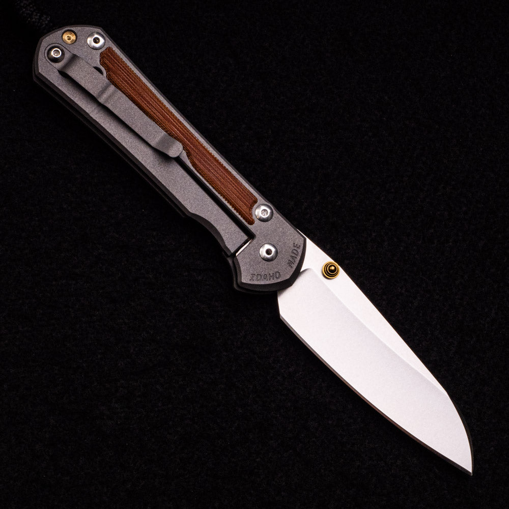 CHRIS REEVE LARGE SEBENZA 31 NATURAL CANVAS MICARTA INLAY – INSINGO CPM MAGNACUT BLADE – GOLD DOUBLE THUMB LUGS