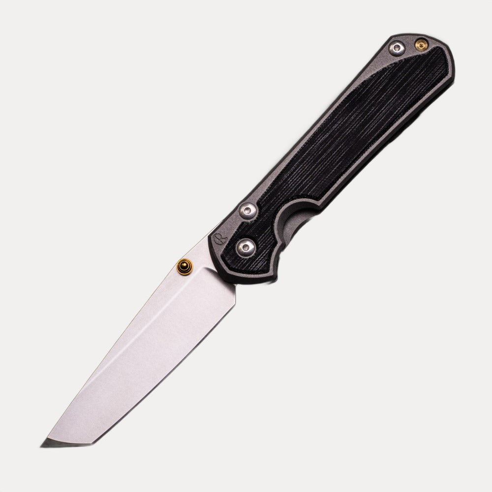 CHRIS REEVE LARGE SEBENZA 31 BLACK CANVAS MICARTA INLAY – TANTO CPM MAGNACUT BLADE – GOLD DOUBLE THUMB LUGS