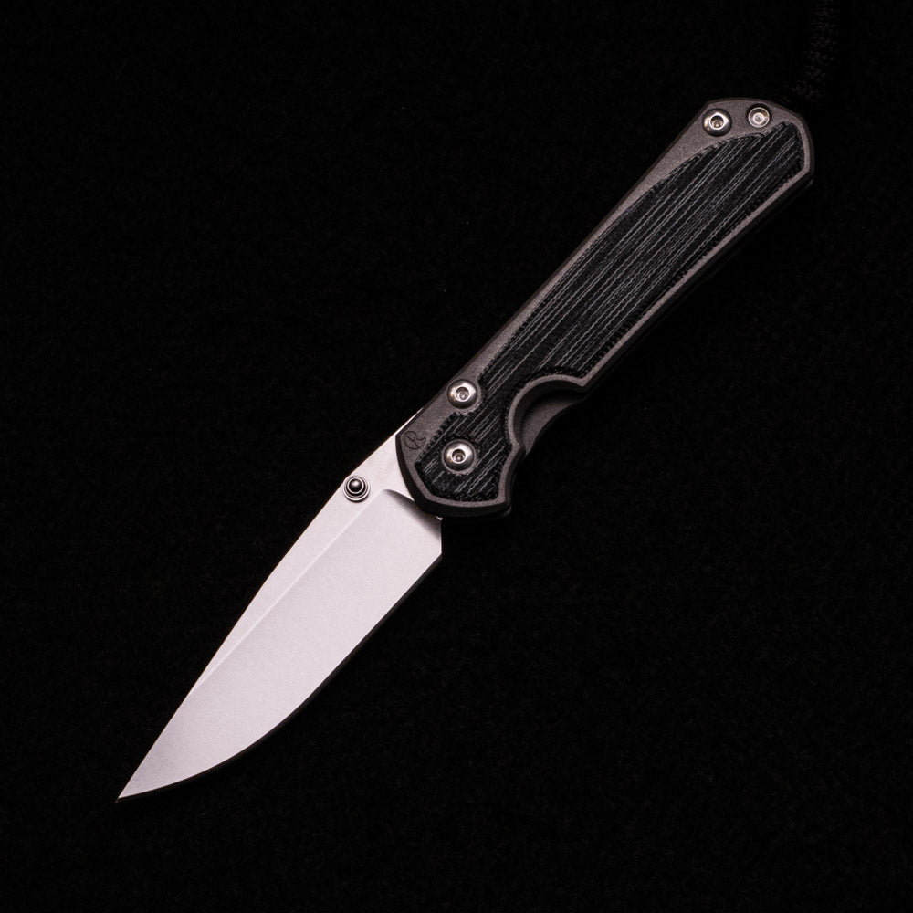 CHRIS REEVE SMALL SEBENZA 31 BLACK CANVAS MICARTA INLAY – CPM MAGNACUT BLADE – SILVER DOUBLE THUMB LUGS