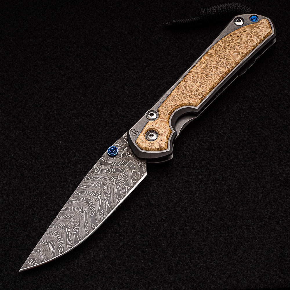 CHRIS REEVE LARGE SEBENZA 31 BOX ELDER BURL INLAY - BOOMERANG BLADE - BLUE DOUBLE THUMB LUGS